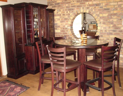 DEWALD-LIQUOR-CABINET-COCKTAIL-TABLE-WITH-MICHAEL-CHAIRS